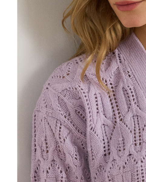 Crafted with a soft blend that includes wool and cotton, this relaxed-fitting V-neck jumper features a beautiful, novelty pointelle stitch.