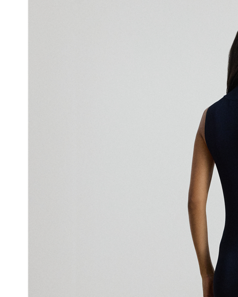 Modern and elegant, this mockneck jumper dress showcases a slim-fitting sleeveless silhouette in a textured rib knit. A skirt slit affords ease of movement.