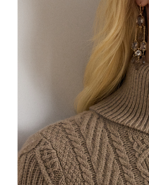 Lauren  Ralph Lauren Lauren reimagines the classic cable-knit jumper as a slim-fitting dress, which is crafted with a soft blend that includes wool and cotton.