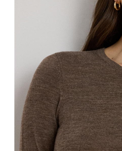 A timeless addition to your cool-weather wardrobe, this crewneck jumper dress features a midi-length A-line silhouette rendered in soft, worsted wool.