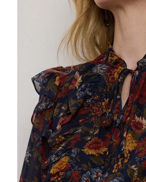 Showcasing painterly florals against a navy backdrop, this tie-neck dress unites a ruffle-trimmed tiered skirt with crinkle georgette for effortless movement with each step.