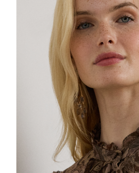 Cascading ruffles and blouson sleeves pair beautifully with the lightweight chiffon fabrication of this blouse, which features a paisley print in the season's earthy colour palette.