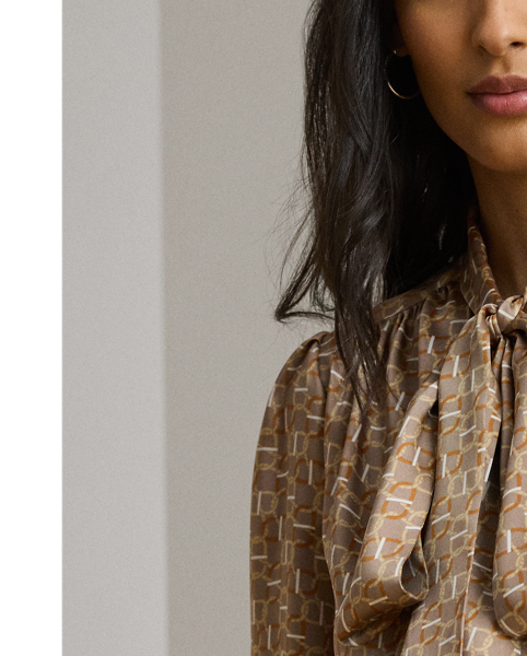 Silky twill brings a subtle sheen and graceful drape to this blouse, which is characterised by a voluminous tie-neck accent and blouson sleeves. This season's iteration showcases a stylised, equestrian-inspired geometric print.