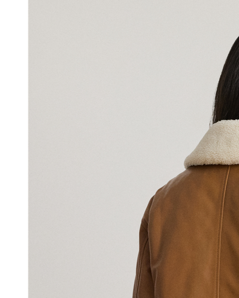 This luxurious take on the surplus-inspired bomber jacket features a lambskin leather shell and a removable, faux-shearling collar for versatile styling.