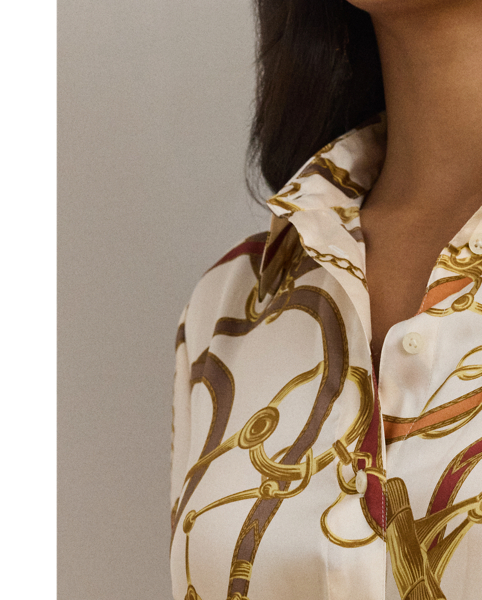 Crafted with smooth twill, this iteration of the classic shirtdress features a belted waist and an equestrian-inspired print that is quintessentially  Ralph Lauren Lauren.
