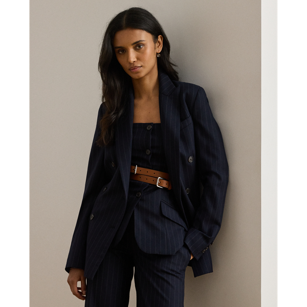 Slender, yarn-dyed pinstripes punctuate the structured silhouette of this sophisticated double-breasted blazer, which is finished with peak lapels and signature horn-effect buttons.