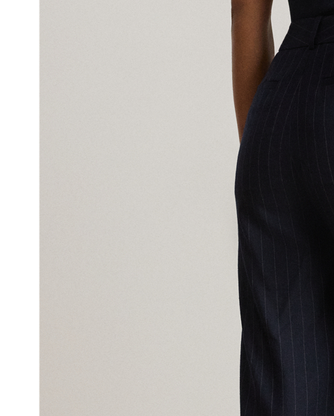 Crisp creases and slender, yarn-dyed pinstripes enhance the leg-lengthening silhouette of these wide-leg trousers, which are tailored from soft wool-blend twill.