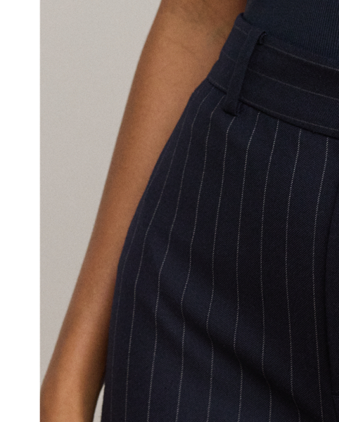 Crisp creases and slender, yarn-dyed pinstripes enhance the leg-lengthening silhouette of these wide-leg trousers, which are tailored from soft wool-blend twill.