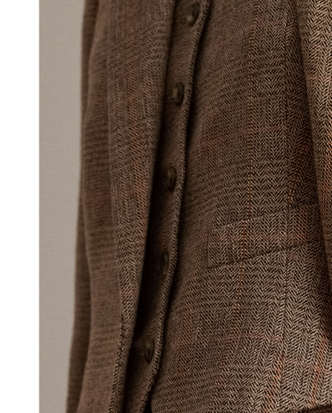 A wardrobe essential, this blazer is rendered in a soft cotton-and-wool blend yarn-dyed with a timeless Glen plaid pattern. Shoulder pads, waist darts and panel seams heighten this style's refined sensibility.