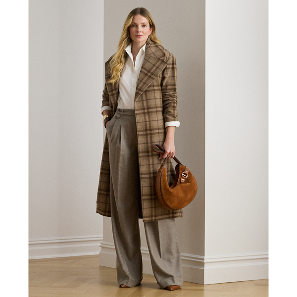 Crisp creases and pleats enhance the wide-leg silhouette of these trousers, which are crafted from wool herringbone twill for subtle texture and a refined sensibility. Displaying a subtle checked pattern, this style is finished with signature horn-effect buttons, waist darts and folded cuffs.