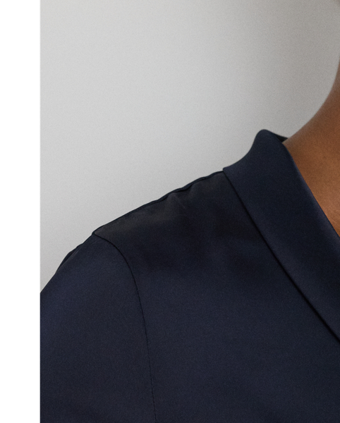 Crafted from satin charmeuse for a beautiful sheen and graceful drape, this blouse is distinguished by a tie-neck detail, which forms a voluminous bow on the front.