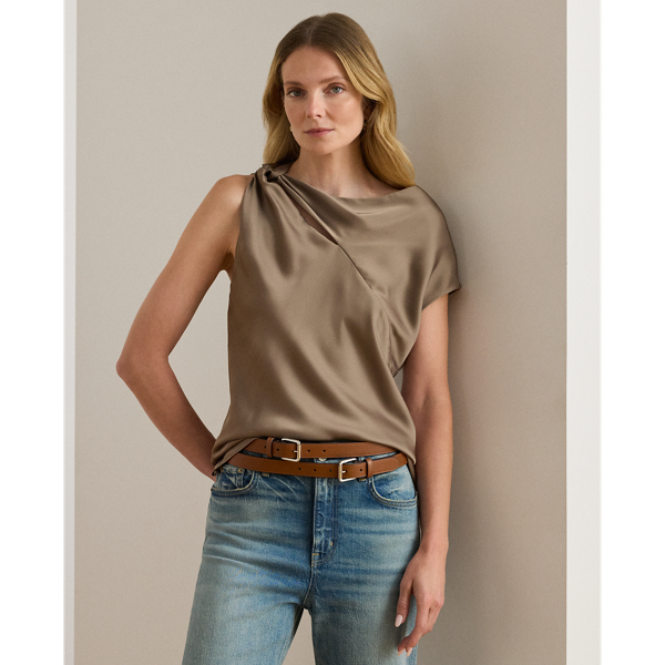 Beautifully draped in glossy satin charmeuse, this blouse features an asymmetrical design with one cap sleeve and a twisted strap. A keyhole detail and pleats at the strap complete the look.
