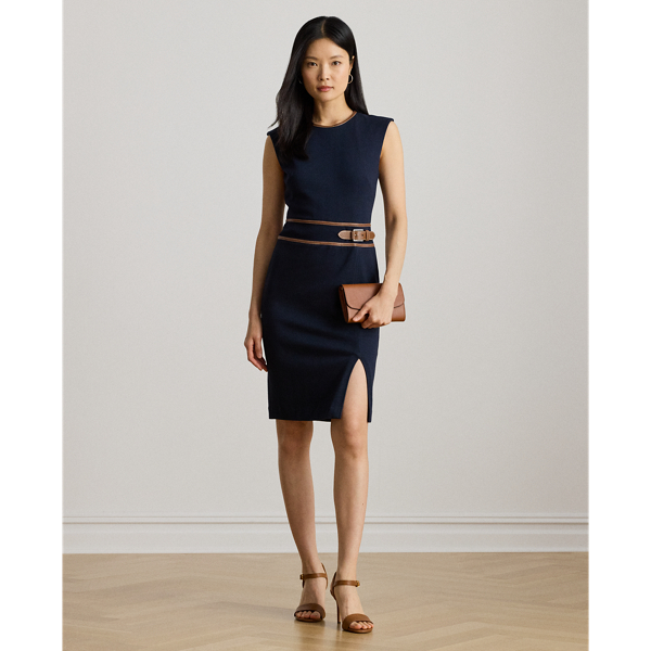 This refined cap-sleeve dress features a faux-leather buckled tab at the waist and a sheath silhouette rendered in stretch-infused, textured herringbone jacquard. A slit in the skirt offers ease of movement.