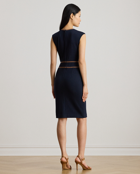 This refined cap-sleeve dress features a faux-leather buckled tab at the waist and a sheath silhouette rendered in stretch-infused, textured herringbone jacquard. A slit in the skirt offers ease of movement.