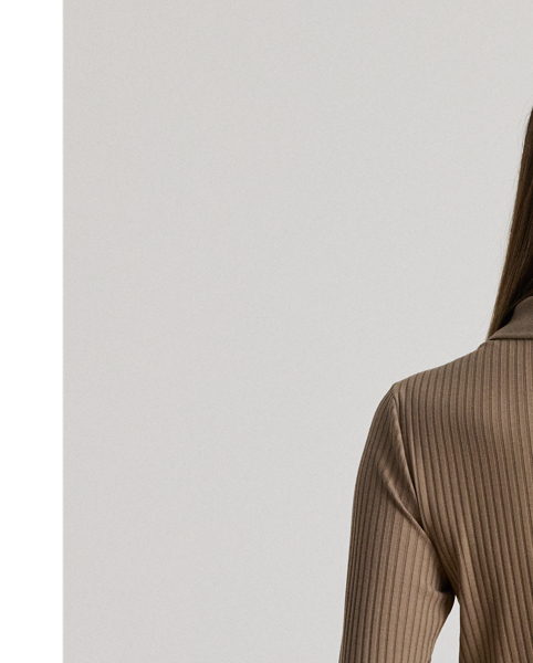 Quintessentially  Ralph Lauren Lauren, this version of the iconic Polo features long sleeves and a dimensional rib-knit construction. A tonal "LRL" logo on the hem completes the look.