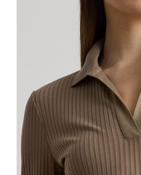 Quintessentially  Ralph Lauren Lauren, this version of the iconic Polo features long sleeves and a dimensional rib-knit construction. A tonal "LRL" logo on the hem completes the look.