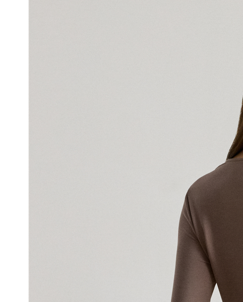 This elegant long-sleeve top features an asymmetrical neckline and a slim silhouette rendered in soft stretch jersey.