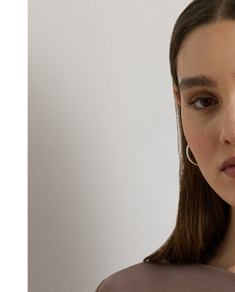 This elegant long-sleeve top features an asymmetrical neckline and a slim silhouette rendered in soft stretch jersey.