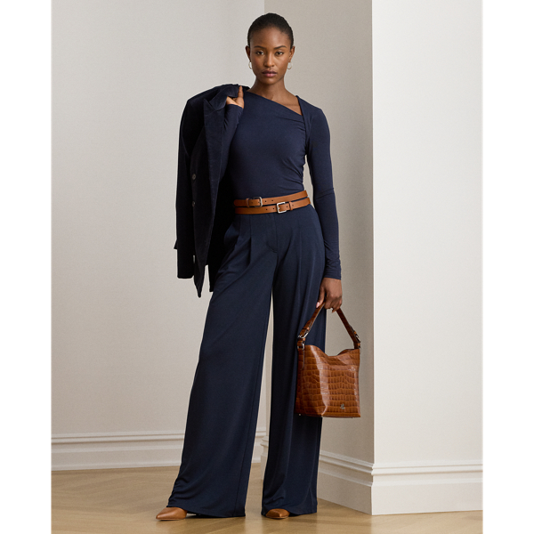 Punctuated by crisp pleats, these trousers combine a stretch jersey fabrication with a wide-leg silhouette for a fluid drape.