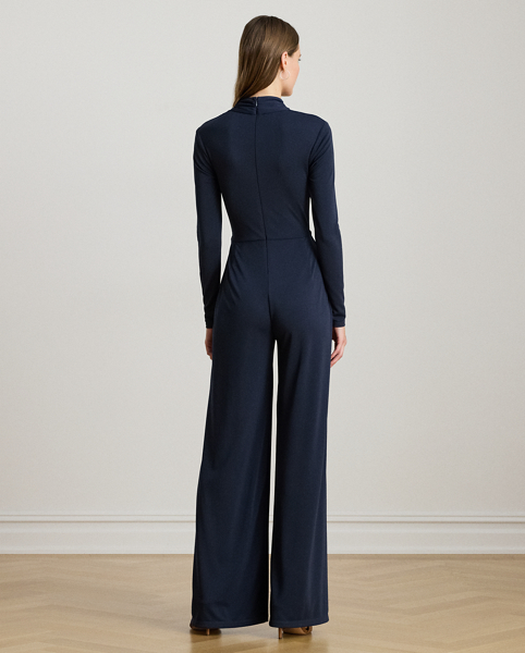 Crafted from smooth stretch jersey, this surplice jumpsuit features a wide-leg silhouette with a wrap-style overlay at the trousers and an equestrian-inspired faux-leather buckled tab at the waist.
