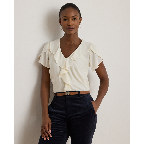 Undeniably romantic, this blouse combines airy georgette with ruffle trim and flutter tulip sleeves.