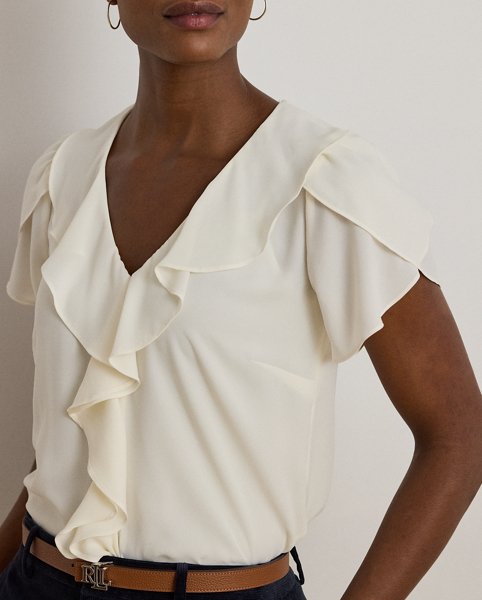Undeniably romantic, this blouse combines airy georgette with ruffle trim and flutter tulip sleeves.