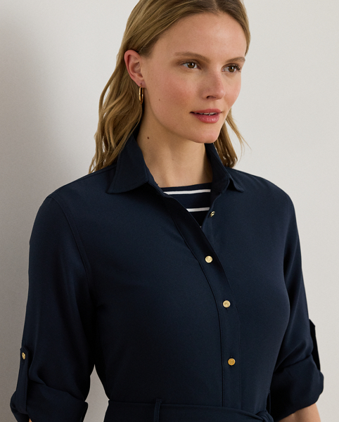 A belted waist enhances the fit-and-flare silhouette of this roll tab-sleeve shirtdress, which is tailored from fluid double-faced georgette.