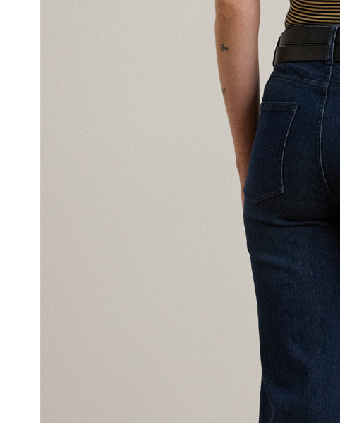 Cut for a leg-lengthening flared silhouette, these high-rise jeans are made from comfortable dark-wash denim, which offers just enough stretch for a relaxed fit and feel.