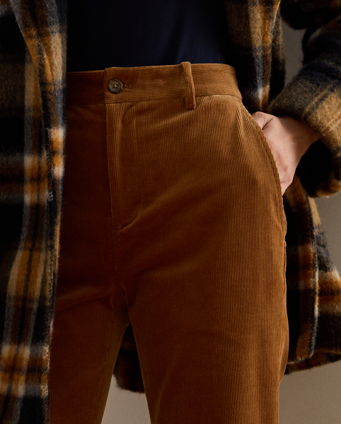 These high-rise trousers showcase a leg-elongating flare silhouette rendered in fine-wale corduroy for subtle texture and a velvety hand feel.