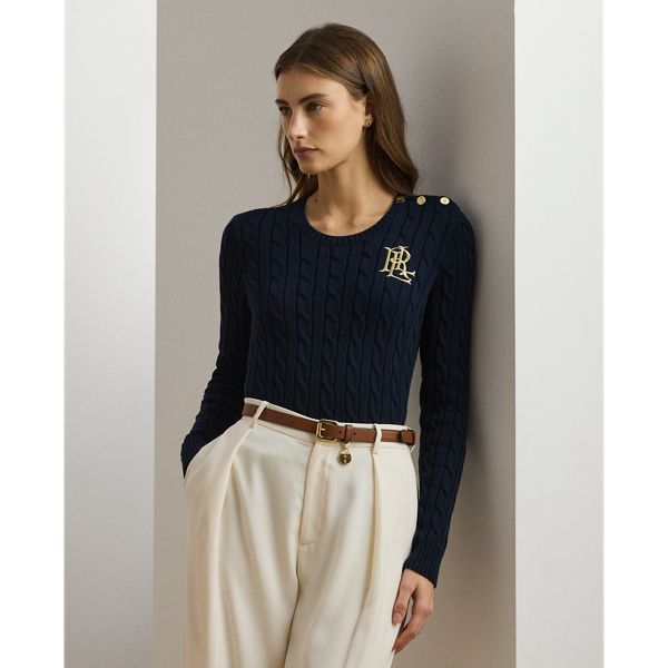 Lauren  Ralph Lauren Lauren updates the classic cable-knit jumper with signature button embellishments on the shoulder and an "LRL"-embroidered logo on the chest. Cut for a slim-fitting silhouette, it's knit from combed cotton for a soft hand.