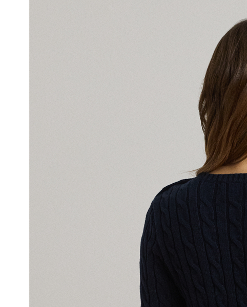 Lauren  Ralph Lauren Lauren updates the classic cable-knit jumper with signature button embellishments on the shoulder and an "LRL"-embroidered logo on the chest. Cut for a slim-fitting silhouette, it's knit from combed cotton for a soft hand.