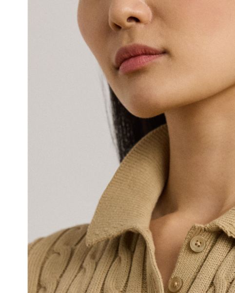 Crafted from combed cotton for a soft hand, this piece unites a timeless Polo shirt silhouette with the comfort of a cable-knit jumper. It's detailed with Lauren's signature embroidered logo and "LRL"-engraved buttons.