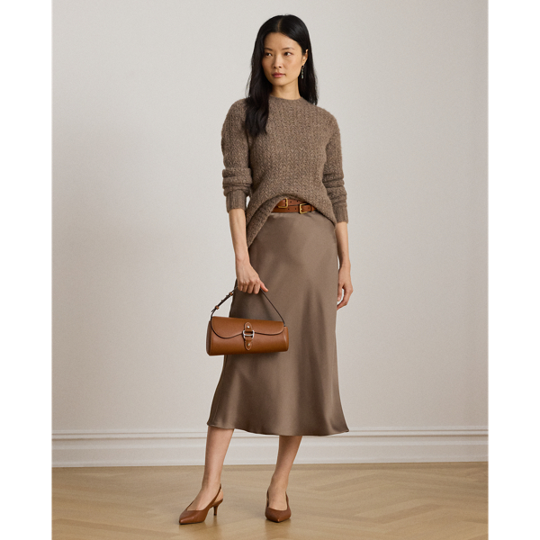 A staple piece that can be easily dressed up or down, this midi skirt is rendered in silky satin charmeuse for a fluid drape and subtle sheen.