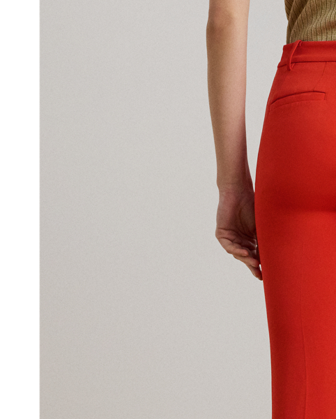Tailored from smooth stretch cady, these slim trousers are detailed with back waist darts and crisp creases on each leg for a polished finish.