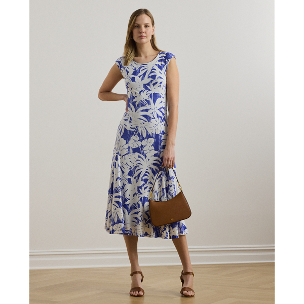 Crafted with smooth stretch jersey for a soft hand and fluid drape, this cap-sleeve dress depicts a palm-frond print in hues of white and blue.