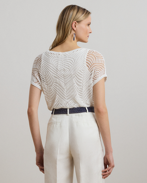 A geometric mesh stitch pattern brings dimension and visual intrigue to this jumper, which is perfect for transitional dressing thanks to its short-sleeve design and lightweight construction.