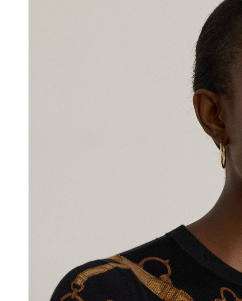 Made with a soft cotton blend for a comfortable feel, this slim-fitting crewneck jumper showcases the season's equestrian-inspired belting print.