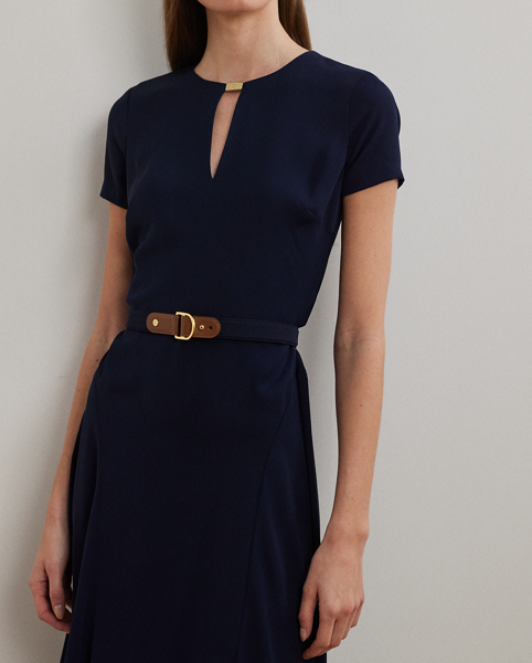 Detailed with a signature plaque on the neck, this fit-and-flare dress is rendered in silky georgette for a luxurious hand and sweeping movement. A faux-leather "LRL"-engraved buckled self-belt completes the look.