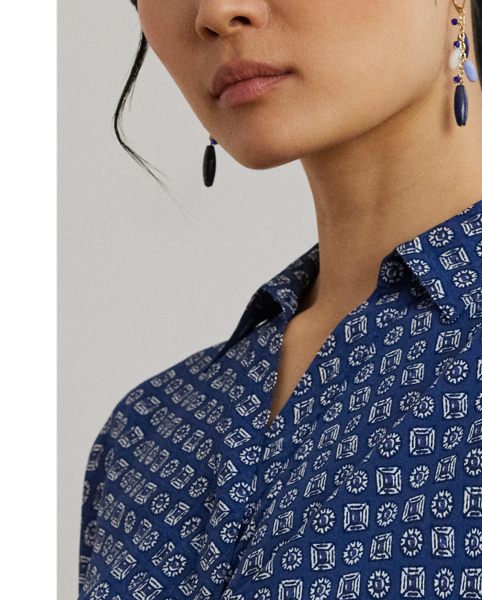 Crafted from airy crepe de chine, this dress balances a spread collar and roll-tab sleeves with a feminine surplice neckline to create a look that is casual yet refined. Detailed with "LRL"-engraved buttons, this version displays the season's stylised geometric print.