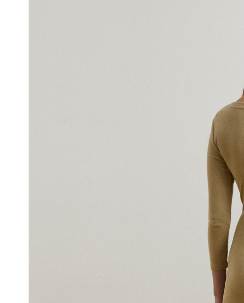 Rib-knit with a soft stretch-cotton blend, this long-sleeve crewneck dress is cut for a slim-fitting silhouette and a calf-grazing midi length. A tie-front design at the waist adds contemporary flare, while a skirt slit affords ease of movement.