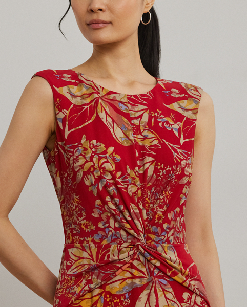 An eye-catching twist-front detail on the bodice serves as the focal point of this cap-sleeve dress, which is crafted from stretch-infused jersey for a soft feel and ease of movement. This version displays a painterly floral motif against a vibrant red backdrop.