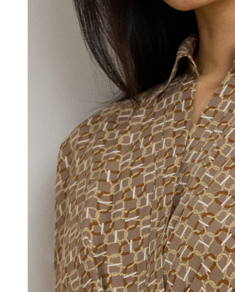 Crafted from airy crepe de chine, this dress balances a spread collar and roll-tab sleeves with a feminine surplice neckline to create a look that is casual yet refined. Detailed with "LRL"-engraved buttons, this version displays a stylised, equestrian-inspired geometric print.