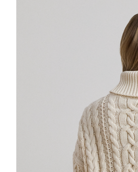 A timeless cold-weather staple, this roll neck jumper showcases a relaxed-fitting, cable-knit silhouette in a soft cotton blend.