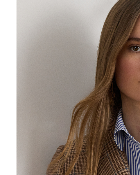 Shoulder pads, princess seams and waist darts enhance the streamlined silhouette of this blazer, which is crafted with soft wool-blend twill. Decorated with signature horn-effect buttons, this style showcases a refined Glen plaid pattern.