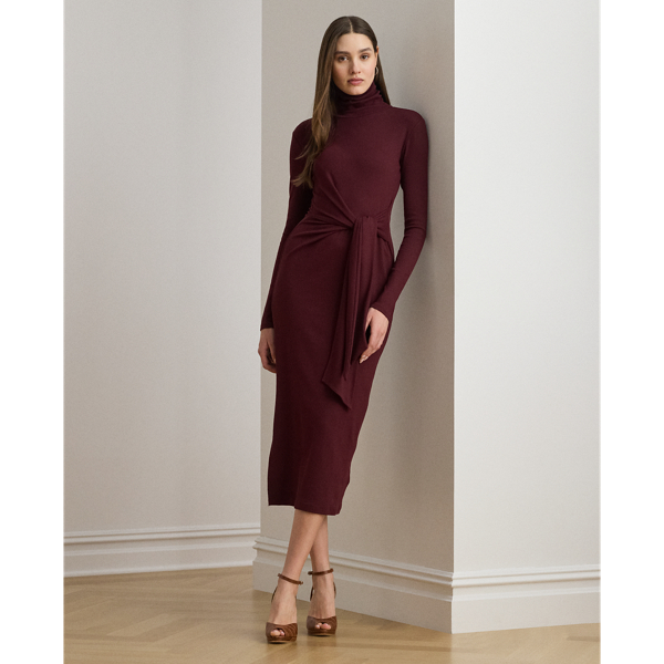 Rib-knit from a soft stretch-cotton blend, this roll neck dress is cut for a slim-fitting silhouette and a calf-grazing midi length. A tie-front design on the waist adds contemporary flare to this refined piece, while slits on the hem afford ease of movement.