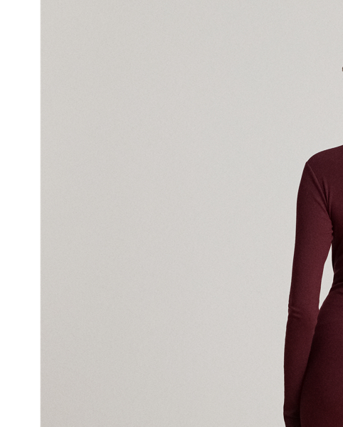 Rib-knit from a soft stretch-cotton blend, this roll neck dress is cut for a slim-fitting silhouette and a calf-grazing midi length. A tie-front design on the waist adds contemporary flare to this refined piece, while slits on the hem afford ease of movement.