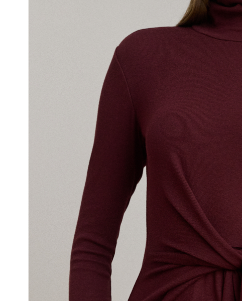 Rib-knit from a soft stretch-cotton blend, this roll neck dress is cut for a slim-fitting silhouette and a calf-grazing midi length. A tie-front design on the waist adds contemporary flare to this refined piece, while slits on the hem afford ease of movement.
