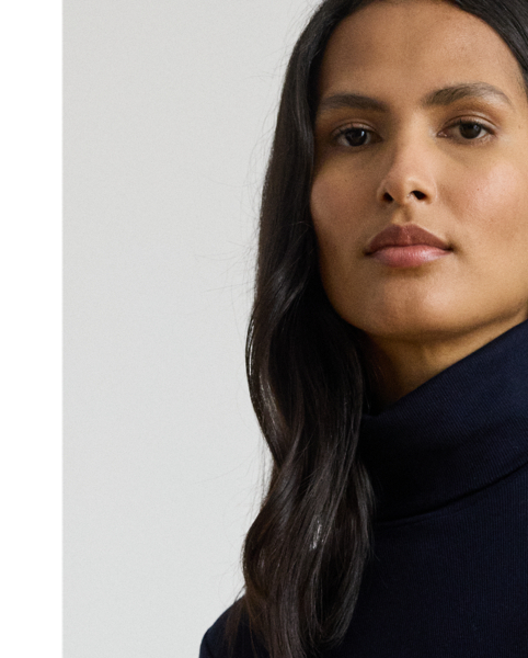 Rib-knit from a soft stretch-cotton blend, this roll neck dress is cut for a slim-fitting silhouette and a calf-grazing midi length. A tie-front design on the waist adds contemporary flare to this refined piece, while slits on the hem afford ease of movement.