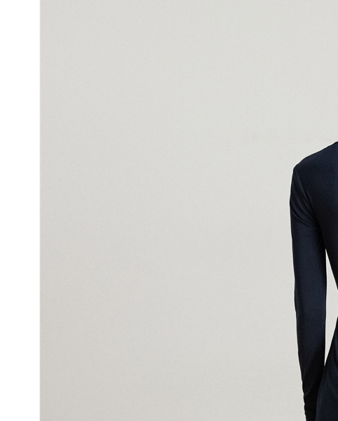 Crafted from smooth stretch jersey, this surplice jumpsuit features a wide-leg silhouette with a wrap-style overlay on the trousers and an equestrian-inspired faux-leather buckled tab on the waist.