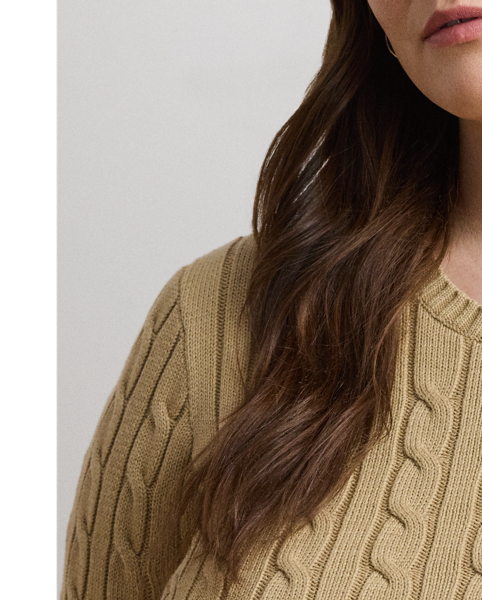 Lauren  Ralph Lauren Lauren updates the classic cable-knit jumper with signature button embellishments on the shoulder and an "LRL"-embroidered logo on the chest. Cut for a slim-fitting silhouette, it's knit from combed cotton for a soft hand.